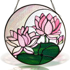 Pink lotus stained glass suncatcher with crescent moon and black frame on a white background