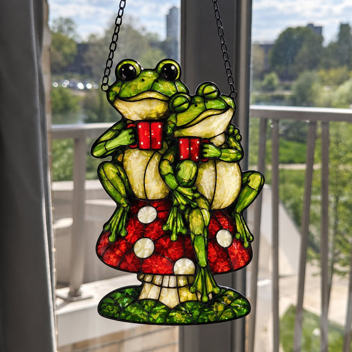 Frog Couple on Mushroom suncatcher in a balcony window
