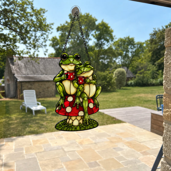 Frog Couple on Mushroom suncatcher in a window over a patio