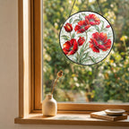 Red poppy suncatcher near a window with colorful light reflection