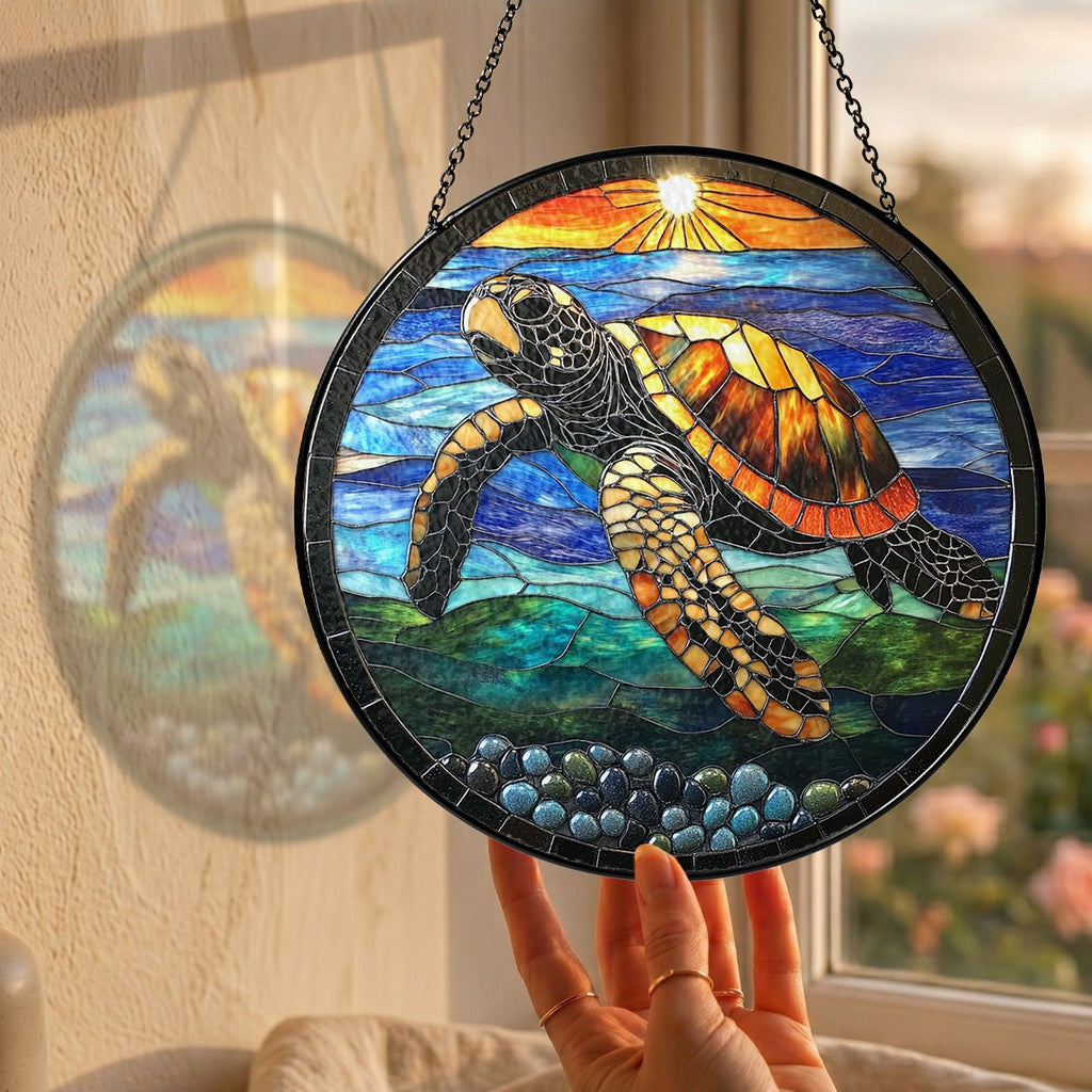 Sea turtle sunset suncatcher hanging in a sunny window