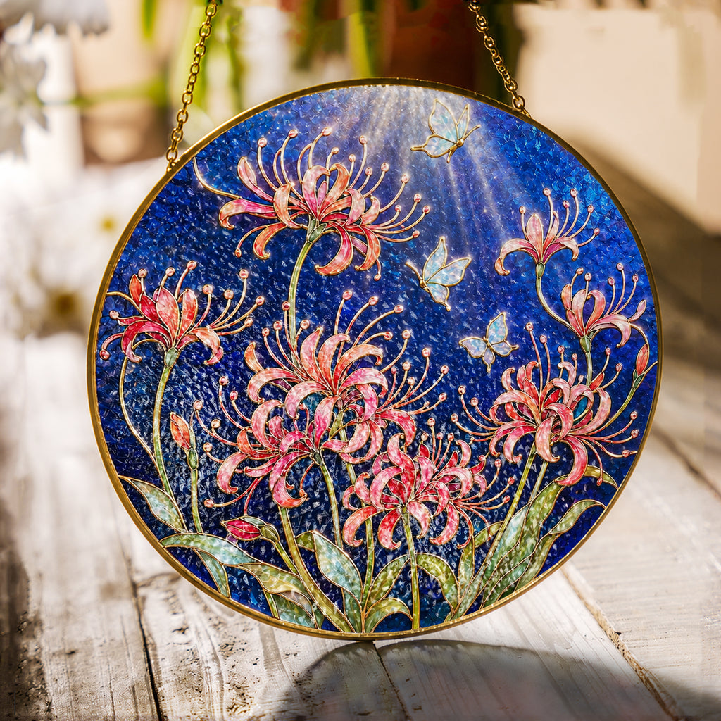 Spider lily and butterfly stained glass suncatcher with gold frame on a white background