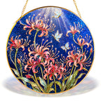 Pink spider lily butterfly gold frame suncatcher in a sunny window