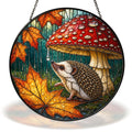 Hedgehog sheltering under a red mushroom in the rain stained glass suncatcher