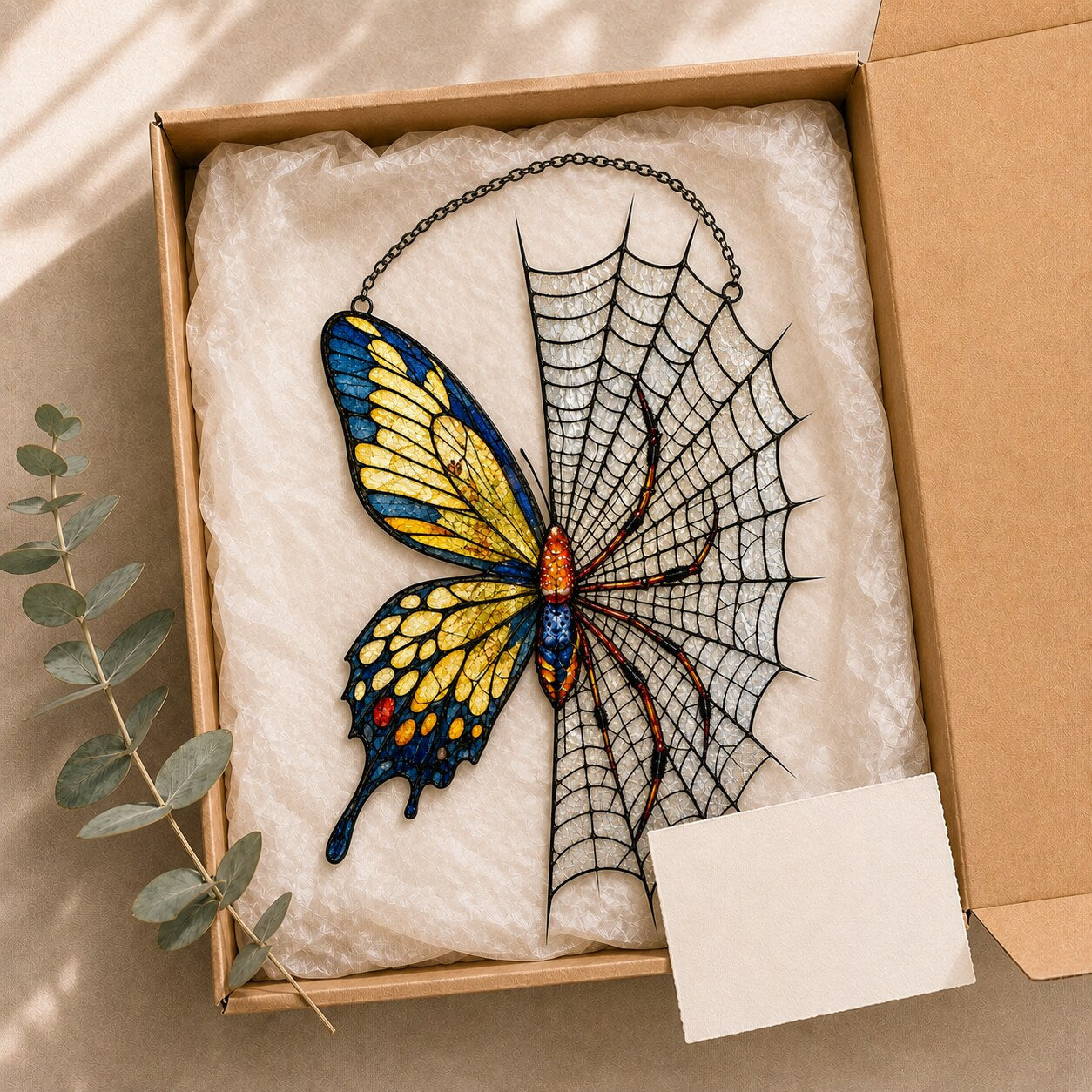 Yellow Butterfly on Spider Web holographic acrylic suncatcher hanging in a sunlit window