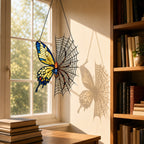 Yellow Butterfly on Spider Web suncatcher on its metal hanging chain in a bright window