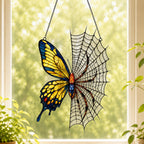 Yellow Butterfly on Spider Web acrylic suncatcher in a warm, softly lit interior