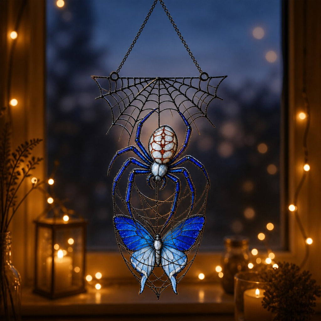 Blue Spider on Web acrylic suncatcher hanging in a window with seasonal decor