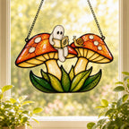 Two Ghosts on Red Mushrooms holographic suncatcher hanging in a living room window