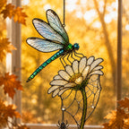 Dragonfly on Daisy suncatcher catching afternoon light in a home window