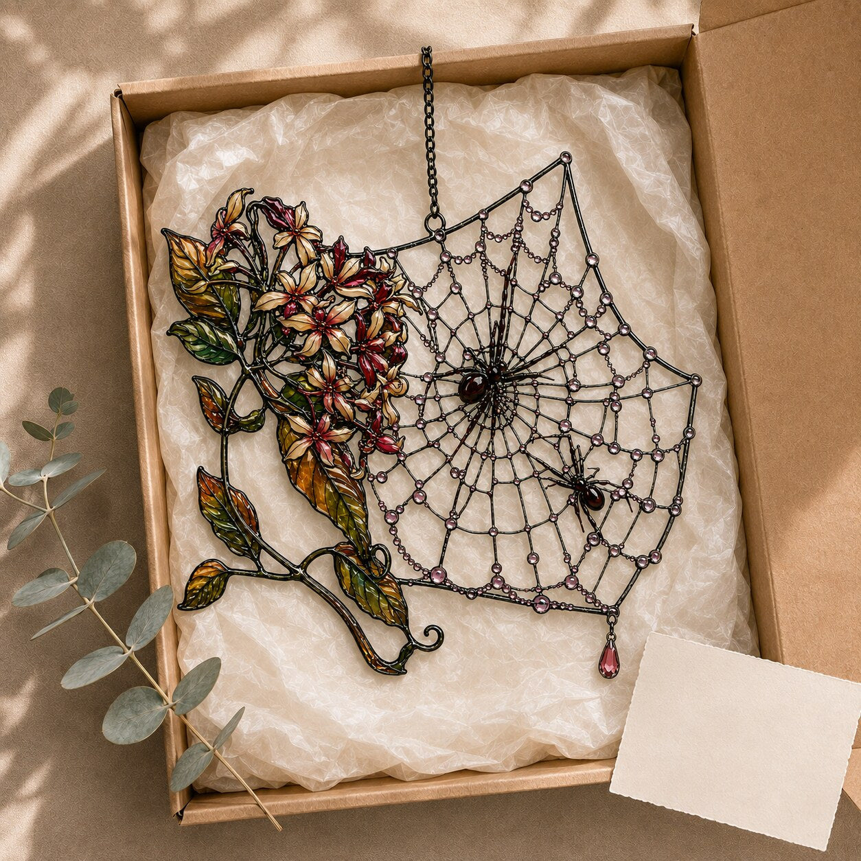 Autumn Spider Web with Flowers holographic acrylic suncatcher hanging in a sunlit window