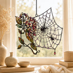 Autumn Spider Web with Flowers acrylic suncatcher hanging in a window with seasonal decor