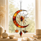 Crescent Moon Spider Web with Bats acrylic suncatcher in a warm, softly lit interior