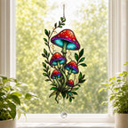 Red Mushroom Cluster with Vines acrylic suncatcher hanging in a window with seasonal decor