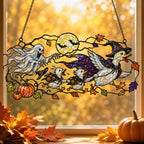 Ghosts and Ravens under the Harvest Moon suncatcher displayed in a home window