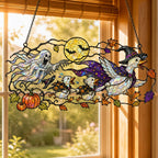 Ghosts and Ravens under the Harvest Moon holographic acrylic suncatcher in natural daylight