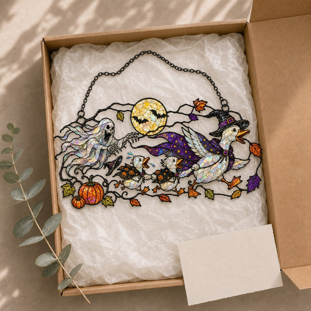 Ghosts and Ravens under the Harvest Moon suncatcher beside a window with seasonal decor
