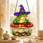 Witch Hat Frog on Red Mushroom holographic acrylic suncatcher hanging in a sunlit window