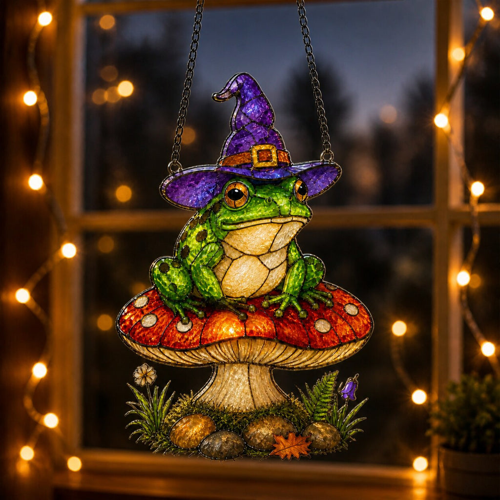 Witch Hat Frog on Red Mushroom holographic suncatcher hanging in a living room window