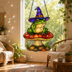 Witch Hat Frog on Red Mushroom acrylic suncatcher in a warm, softly lit interior