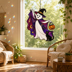 Trick-or-Treat Ghost with Pumpkin Bucket holographic acrylic suncatcher hanging in a sunlit window