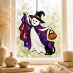 Trick-or-Treat Ghost with Pumpkin Bucket window suncatcher seen against a sunlit garden