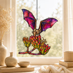 Pink Bat over Autumn Blooms holographic suncatcher with sunlight passing through the acrylic
