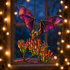 Pink Bat over Autumn Blooms window suncatcher seen against a sunlit garden