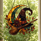 Witch Hat and Broom on Crescent Moon window suncatcher seen against a sunlit garden