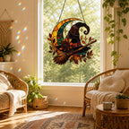 Witch Hat and Broom on Crescent Moon suncatcher displayed in a home window