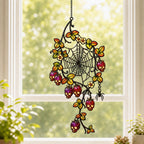Spider Web with Autumn Berries acrylic suncatcher hanging in a window with seasonal decor