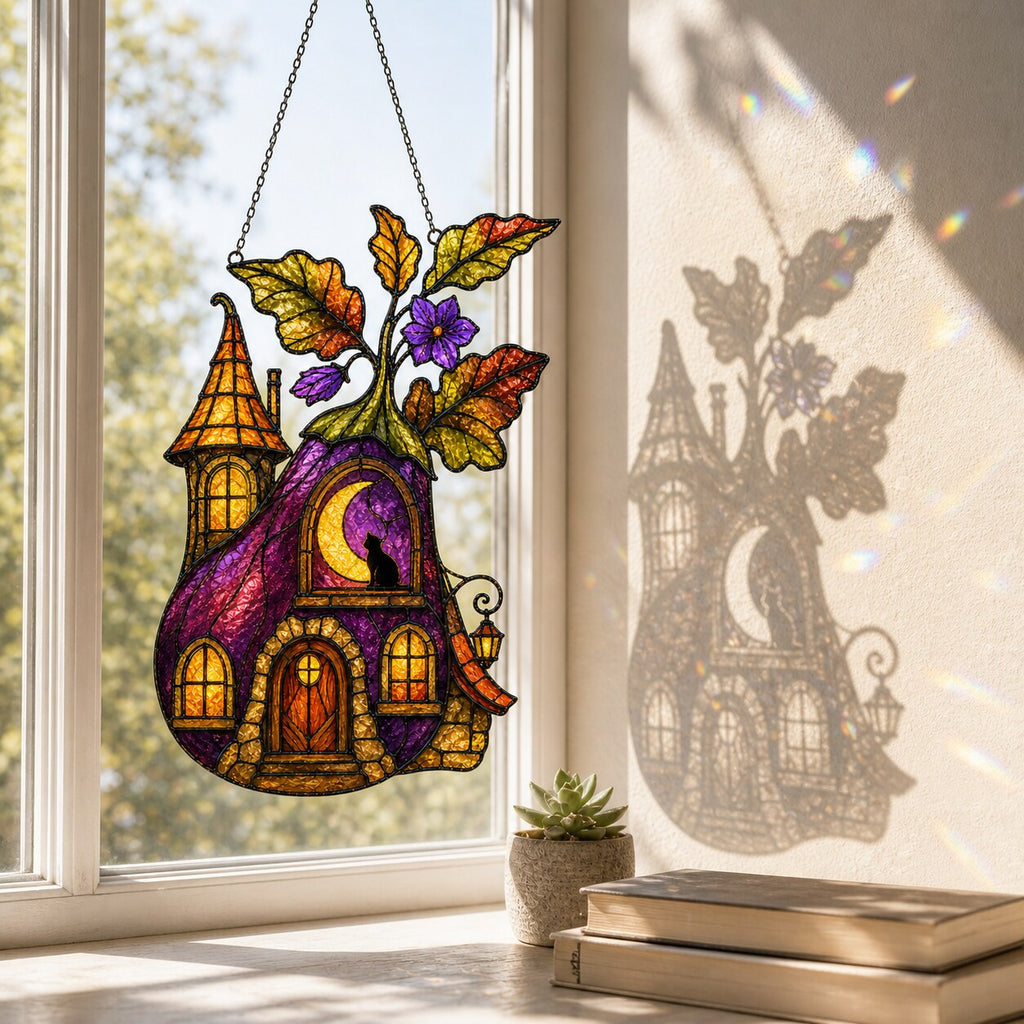 Purple Witch Cottage with Crescent Moon suncatcher catching afternoon light in a home window