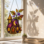 Purple Witch Cottage with Crescent Moon suncatcher catching afternoon light in a home window