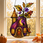 Purple Witch Cottage with Crescent Moon suncatcher displayed in a home window