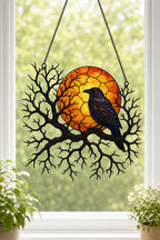 Raven on Branch with Harvest Moon holographic acrylic suncatcher styled in a cozy room