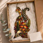 Close-up of the Mushrooms, Ferns and Skull holographic suncatcher showing its stained-glass style artwork