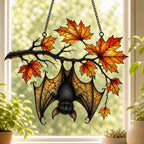 Sleeping Bat under Maple Branch acrylic suncatcher hanging in a window with seasonal decor
