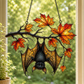 Sleeping Bat under Maple Branch suncatcher on its metal hanging chain in a bright window