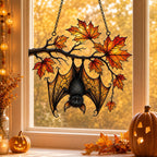 Sleeping Bat under Maple Branch window suncatcher seen against a sunlit garden
