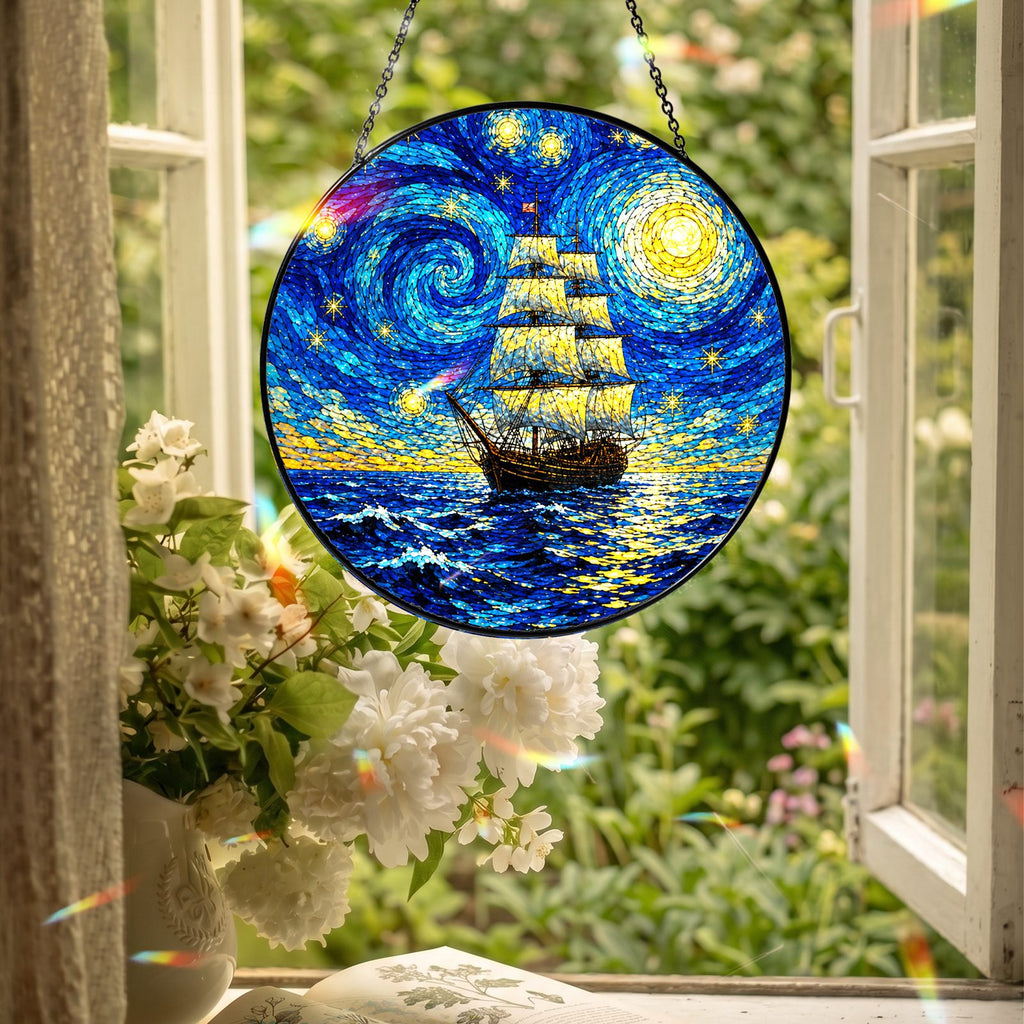 Starry Night tall ship suncatcher hanging in an open window