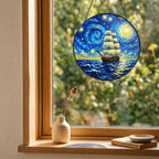 Starry Night tall ship suncatcher on a windowsill