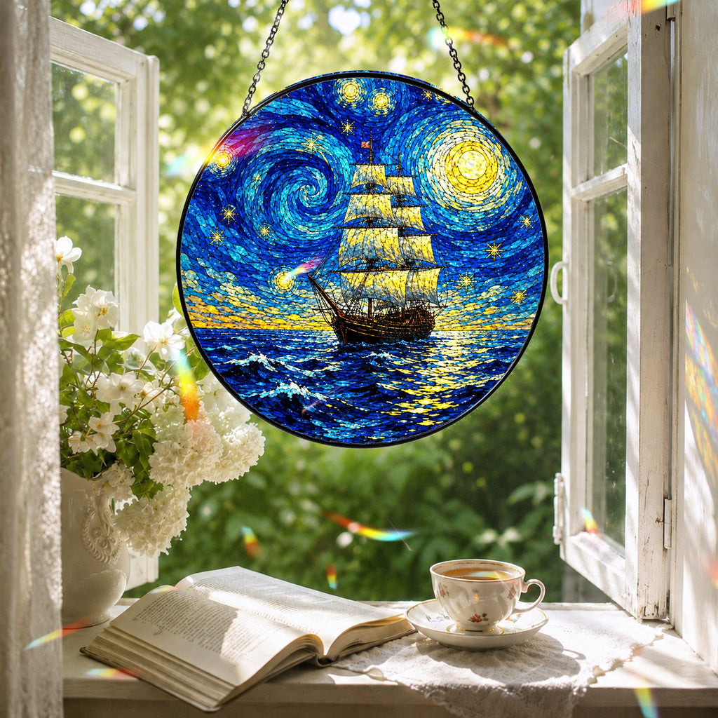 Starry Night tall ship suncatcher in a reading nook window