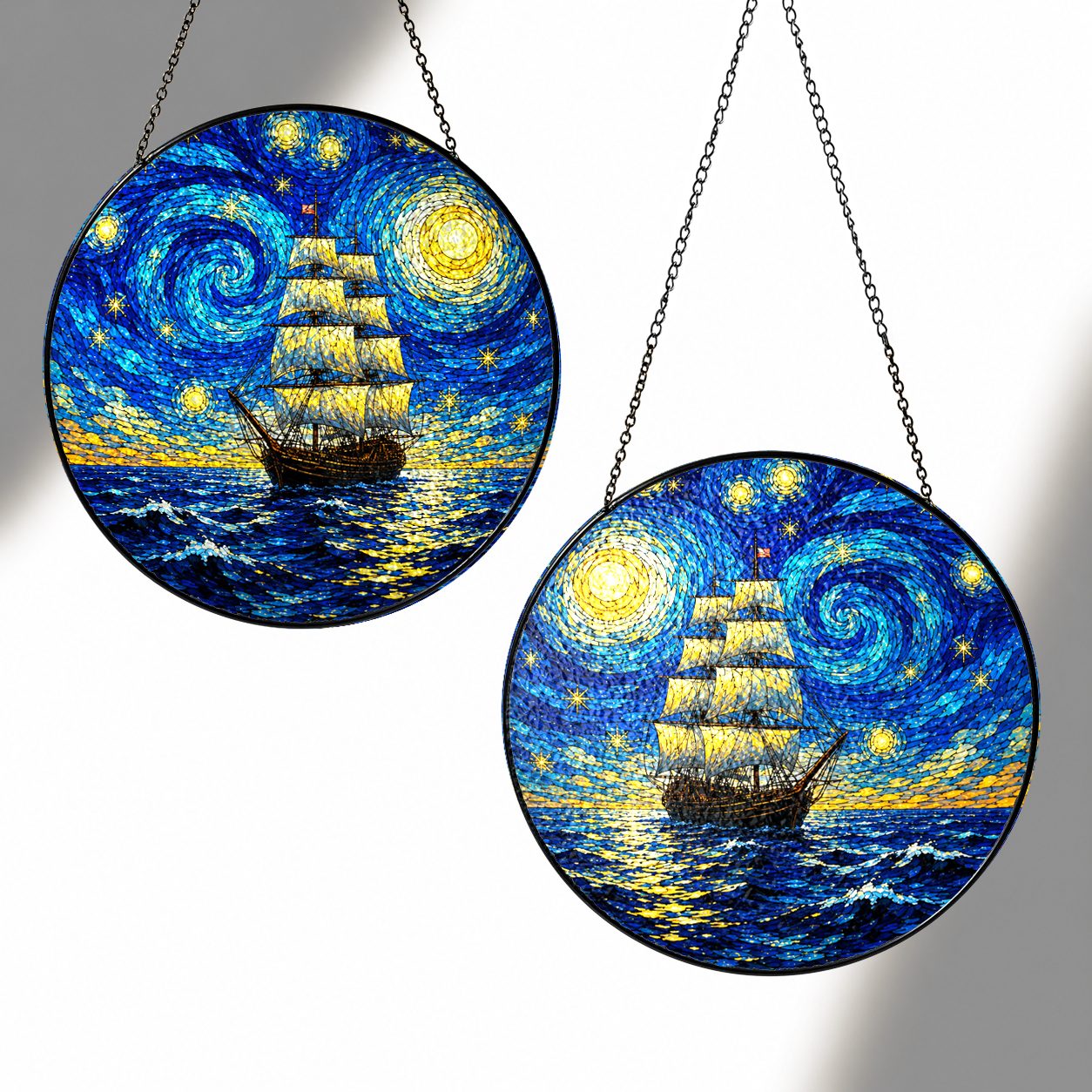 Two sizes of the Starry Night tall ship suncatcher side by side