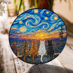 Four cats sunset suncatcher on a wooden table in sunlight