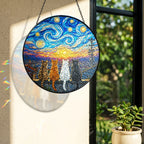 Rainbow light cast by the four cats stained glass suncatcher