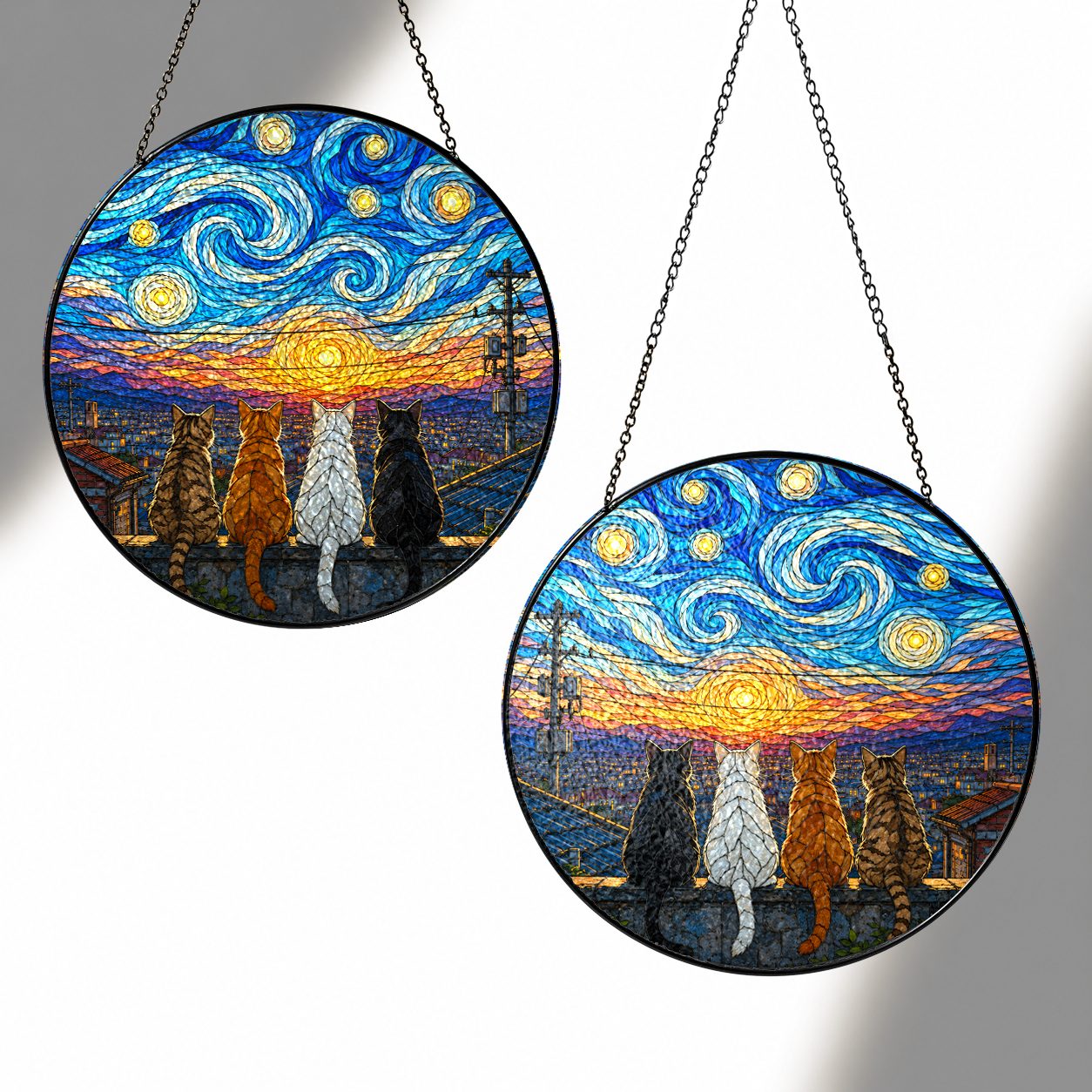 Two sizes of the four cats suncatcher side by side