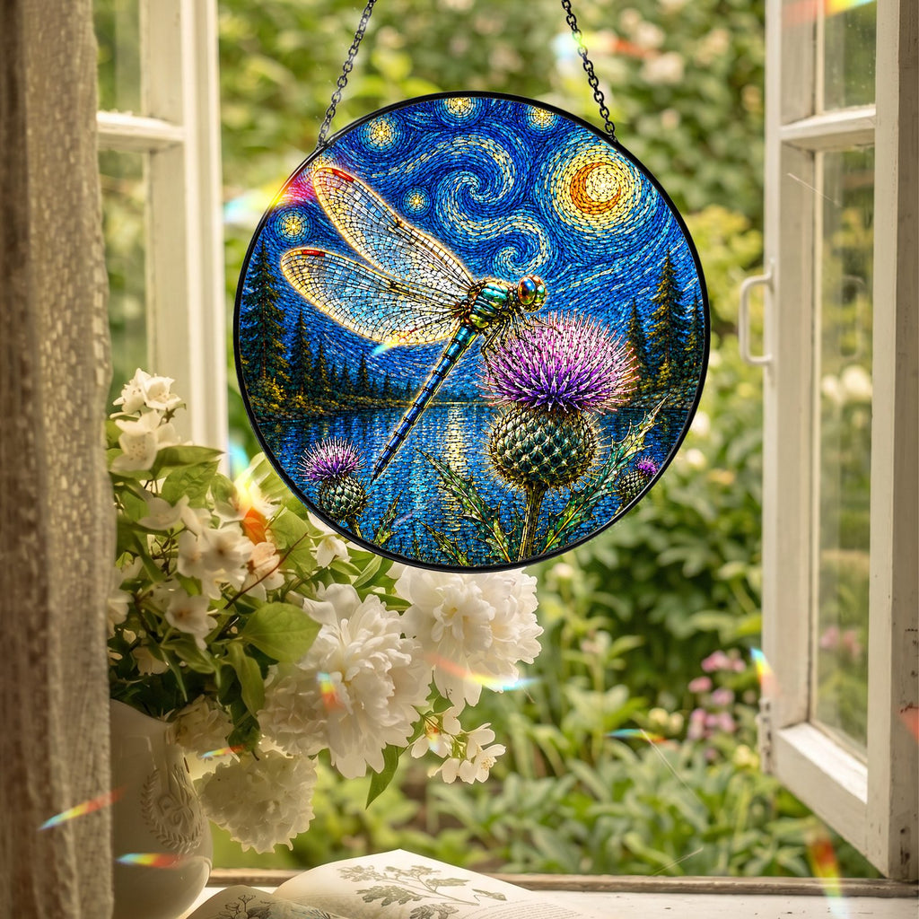 Dragonfly suncatcher hanging in an open window