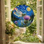 Dragonfly suncatcher hanging in an open window