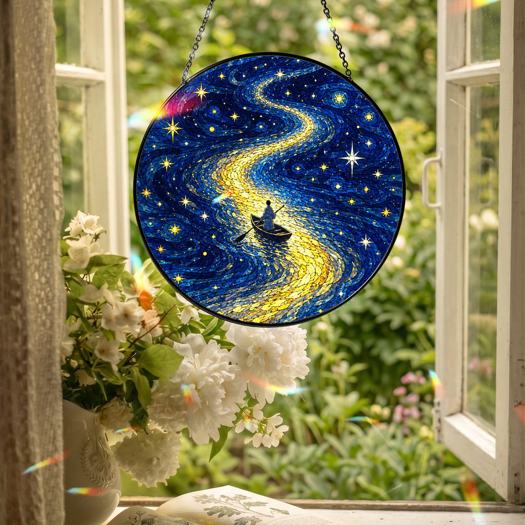 Rowboat suncatcher hanging in an open window
