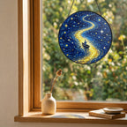 Rowboat suncatcher on a windowsill